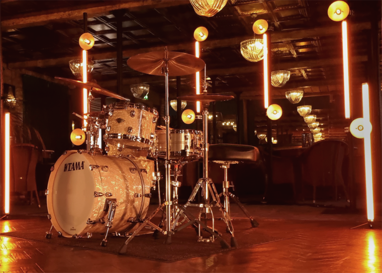 A drumkit lit with CTO lighting and Astera tubes