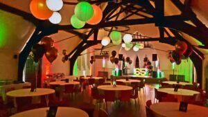 A function room lit up in Italian themed lighting.