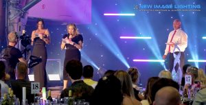 Awards presentation on a runway-themed stage at the Concorde Conference Centre at Runway Visitor Park